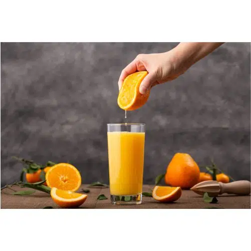 glass orange juice person squeezing orange it 1 نمای بالا-طبیعی-خاک