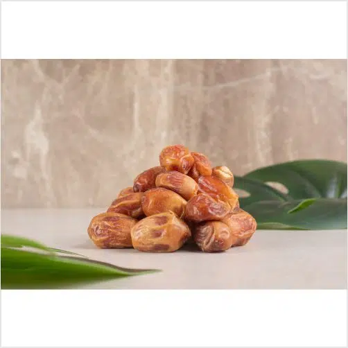 yellow dry dates isolated concrete around green leaves 1 تصویر با کیفیت خرما زاهدی