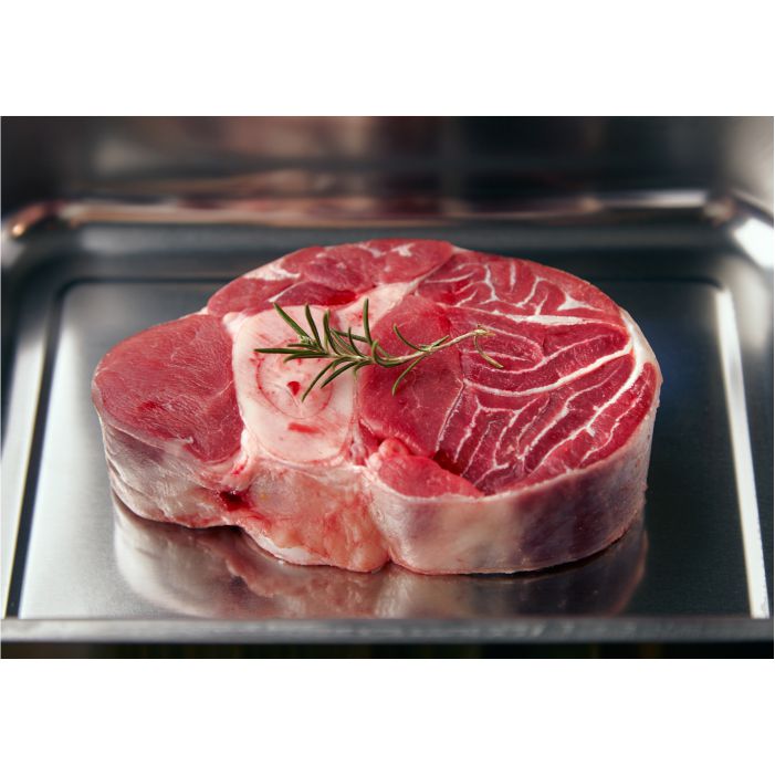 closeup piece leg angus steak with rosemary leaf top inside steel pan ready cook 1