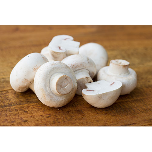 fresh mushrooms wodden background 1 بشقاب