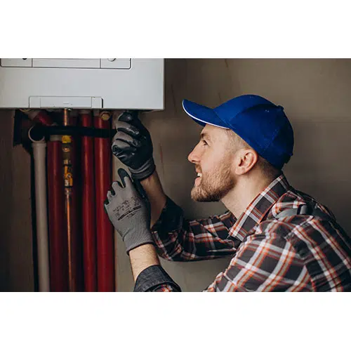 service man adjusting house heating system 1 تصویر