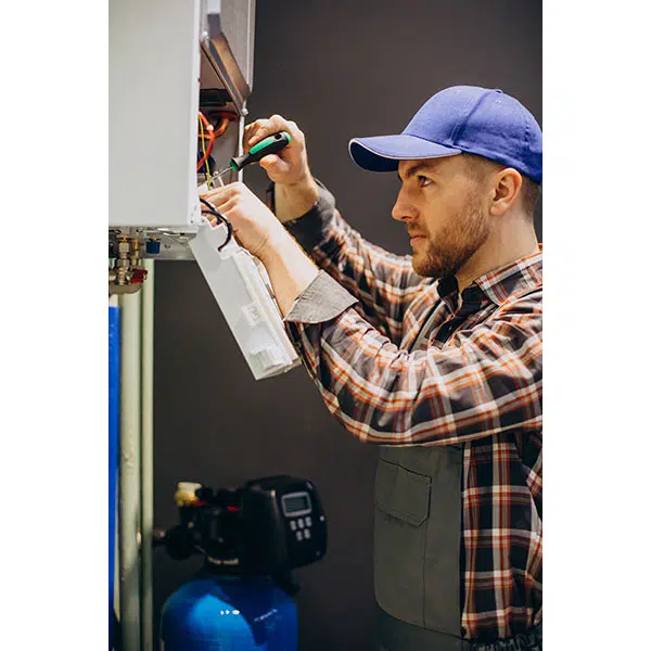 service man adjusting house heating system 2 عکس