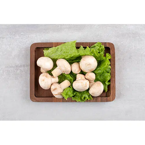 بشقاب چوبی با کاهو و قارچ تازه 1 wooden plate full fresh champignon mushrooms placed stone table 1 بشقاب